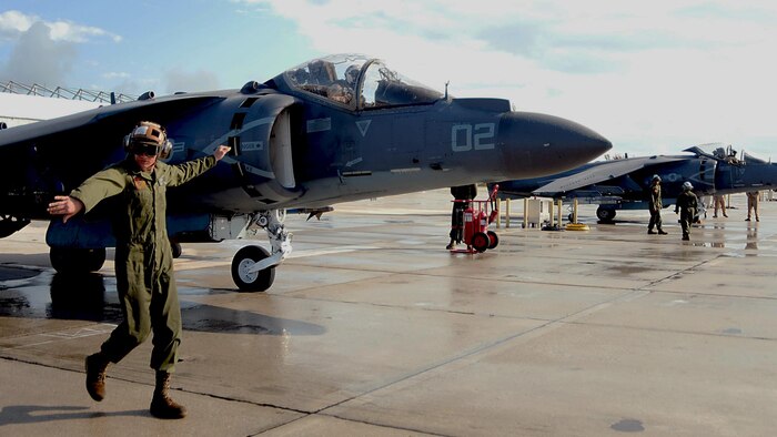 Plane captain Lance Cpl. Joseph Crescenzo, of Ocala, Fla., signals stand clear to maintainers while directing an AV-8B Harrier assigned to the Bulldogs of Marine Attack Squadron (VMA) 223 at Key West, Florida March 24. Naval Air Station Key West is a state-of-the-art facility for air-to-air combat fighter aircraft of all military services and provides world-class pierside support to U.S. and foreign naval vessels. (U.S. Navy photo by Mass Communication Specialist 1st Class Brian Morales/ Released)