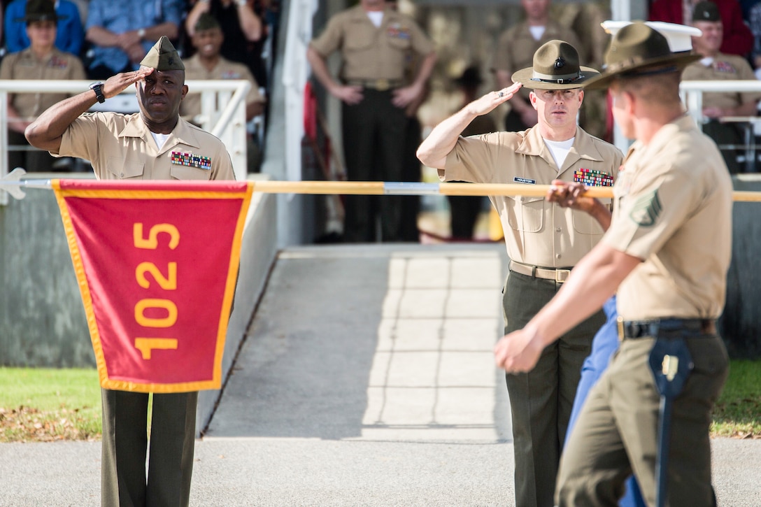 Sgt. Maj. of the Marine Corps Ronald L. Green (left) salutes during the pass in review of Delta Company, 1st Recruit Training Battalion, April 10, 2015, on Parris Island, S.C. Green, from Jackson, Miss., was the parade reviewing official for Delta Company’s graduation ceremony. (Photo by Sgt. Jennifer Schubert)