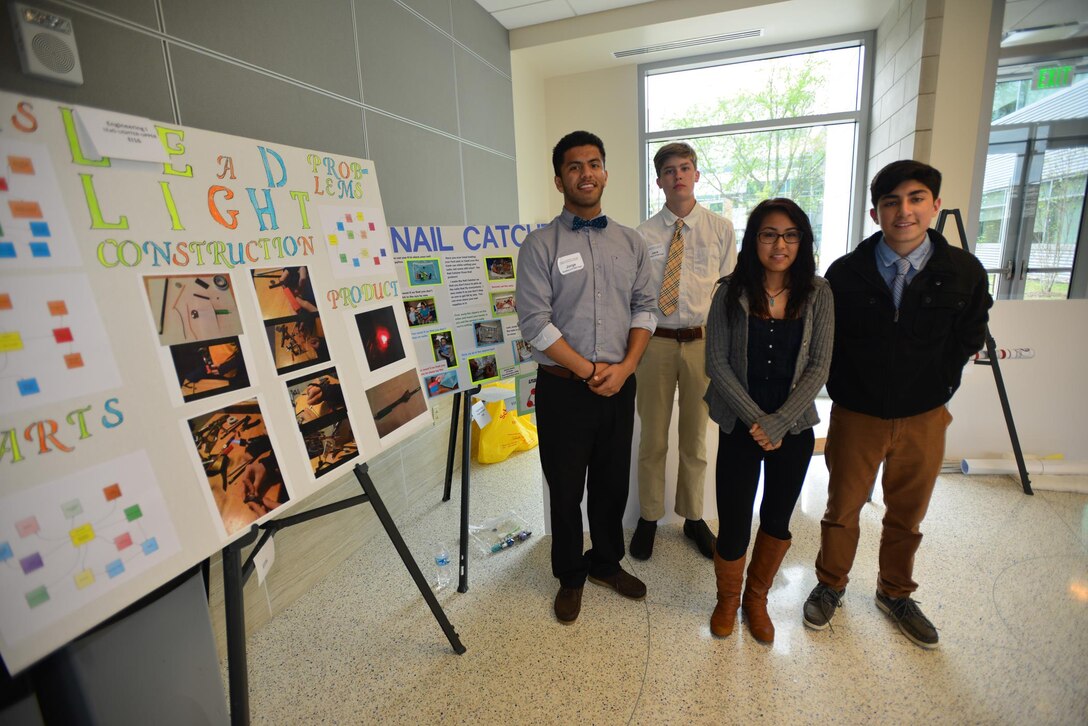 A team of high scholl students from Stratford High School (left to right)Jorge Carriedo, Jack Utley Mia Campbell–Smith,  and Christian Molnia deliver a brief presentation of their STEM project during a Science, Technology, Engineering and Mathematics Science Expo presented by the Middle Tennessee STEM Innovation Hub at the Middle Tennessee State University in Murfreesboro on April 9. 