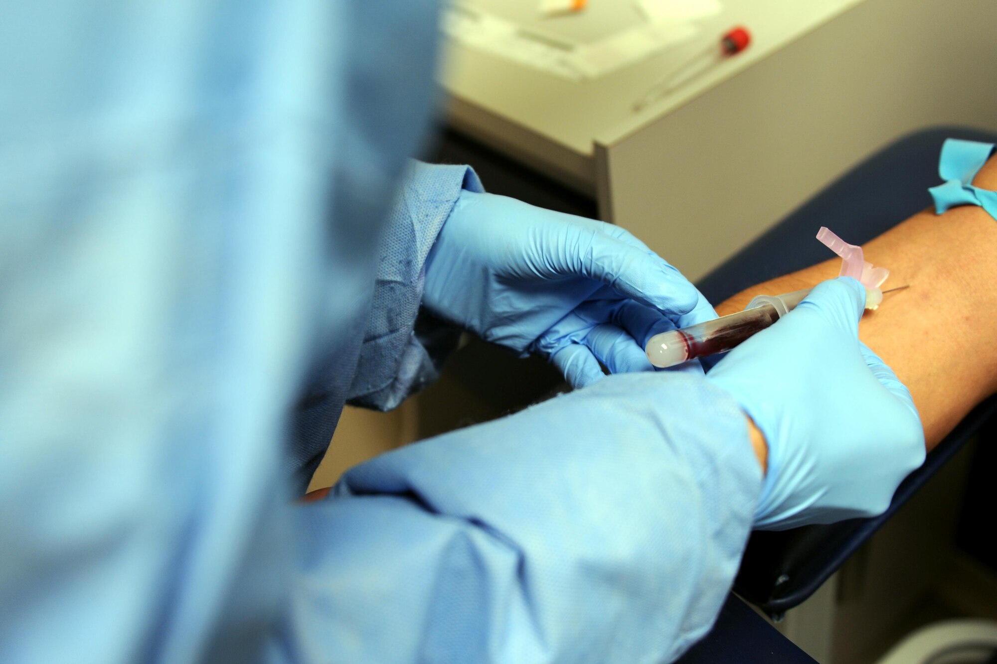 Senior Airman Ozias Sanchez, 1st Special Operations Medical Support Squadron laboratory technician, draws blood from Senior Airman Alexander Avalos-Mora, 1st Special Operations Logistics Readiness Squadron fuels distribution operator, on Hurlburt Field, Fla., April 8, 2015. The 1st SOMDSS Laboratory is comprised of seven personnel who are responsible for more than 17,000 beneficiaries and 156,000 tests a year. (U.S. Air Force photo/Staff Sgt. Katherine Holt)