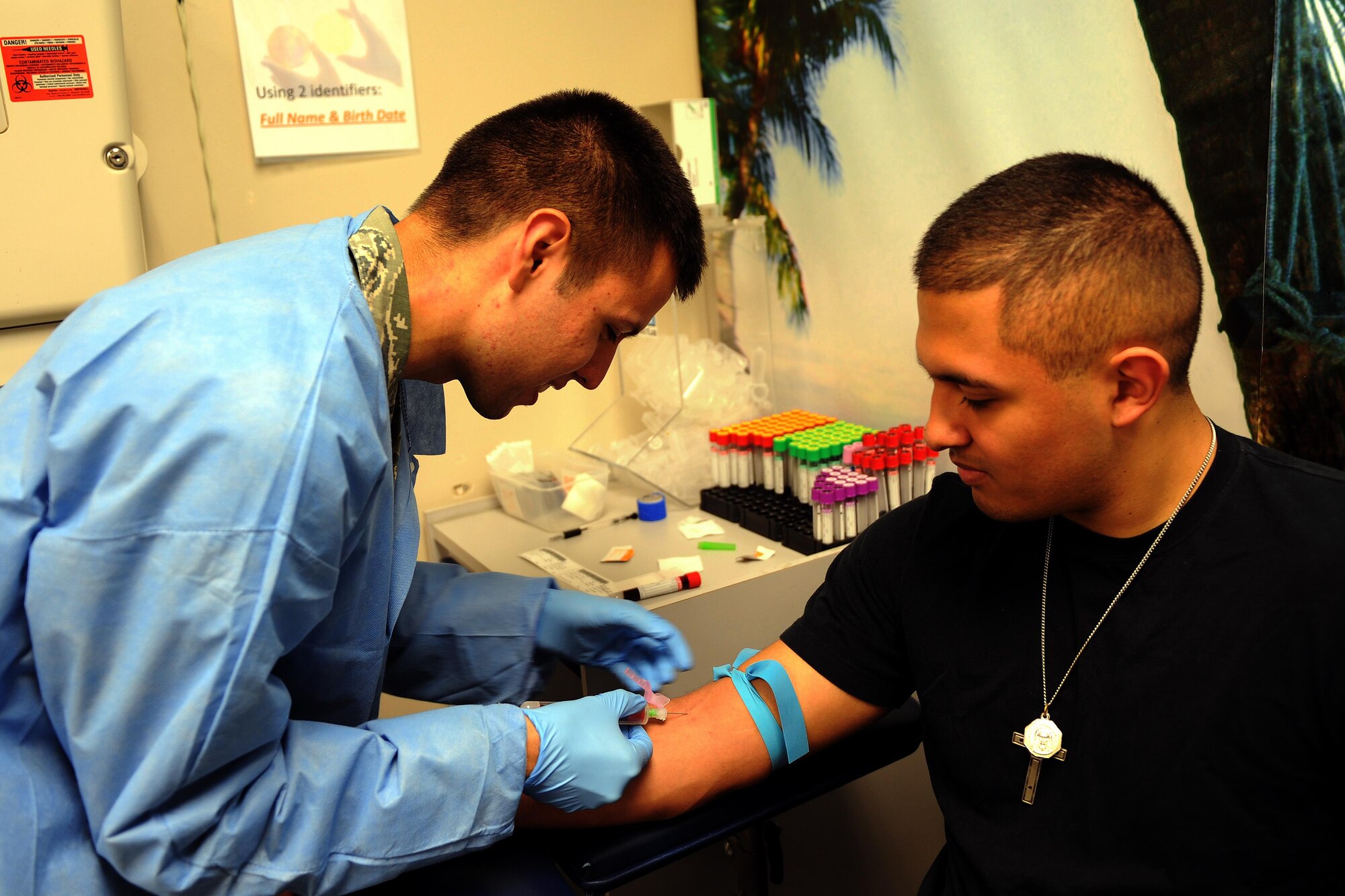 Senior Airman Ozias Sanchez, 1st Special Operations Medical Support Squadron laboratory technician, draws blood from Senior Airman Alexander Avalos-Mora, 1st Special Operations Logistics Readiness Squadron fuels distribution operator, on Hurlburt Field, Fla., April 8, 2015. The general technicians rotate on a weekly basis to perform everything from phlebotomy to chemistry and hematology to serology. (U.S. Air Force photo/Staff Sgt. Katherine Holt)