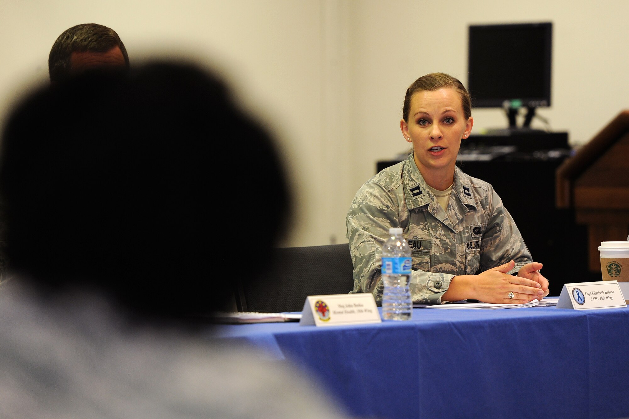 U.S. Air Force Capt. Elizabeth Belleau, 18th Wing sexual assault response coordinator, answers questions at a sexual assault prevention and response leadership panel on Kadena Air Base, Japan, April 14, 2015. The panel was the first of its kind at Kadena and was designed to provide an opportunity for leaders to discuss the many parts of the SAPR investigation process with representatives from each agency involved. (U.S. Air Force photo by Airman 1st Class Zade C. Vadnais)