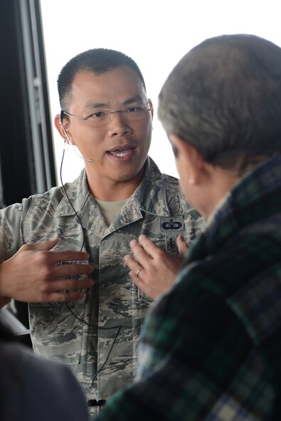 Tech. Sgt. Lan Nguyen, 374th Operation Support Squadron air traffic controller, answers questions during the Mid-Air Collision Avoidance conference at Yokota Air Base, Japan, April 11, 2015. The MACA conference is designed to give local pilots a better understanding of Yokota's flight and approach control operations leading to a safer flying environment across the Kanto Plain. (U.S. Air Force photo by Airman 1st Class David C. Danford/Released)