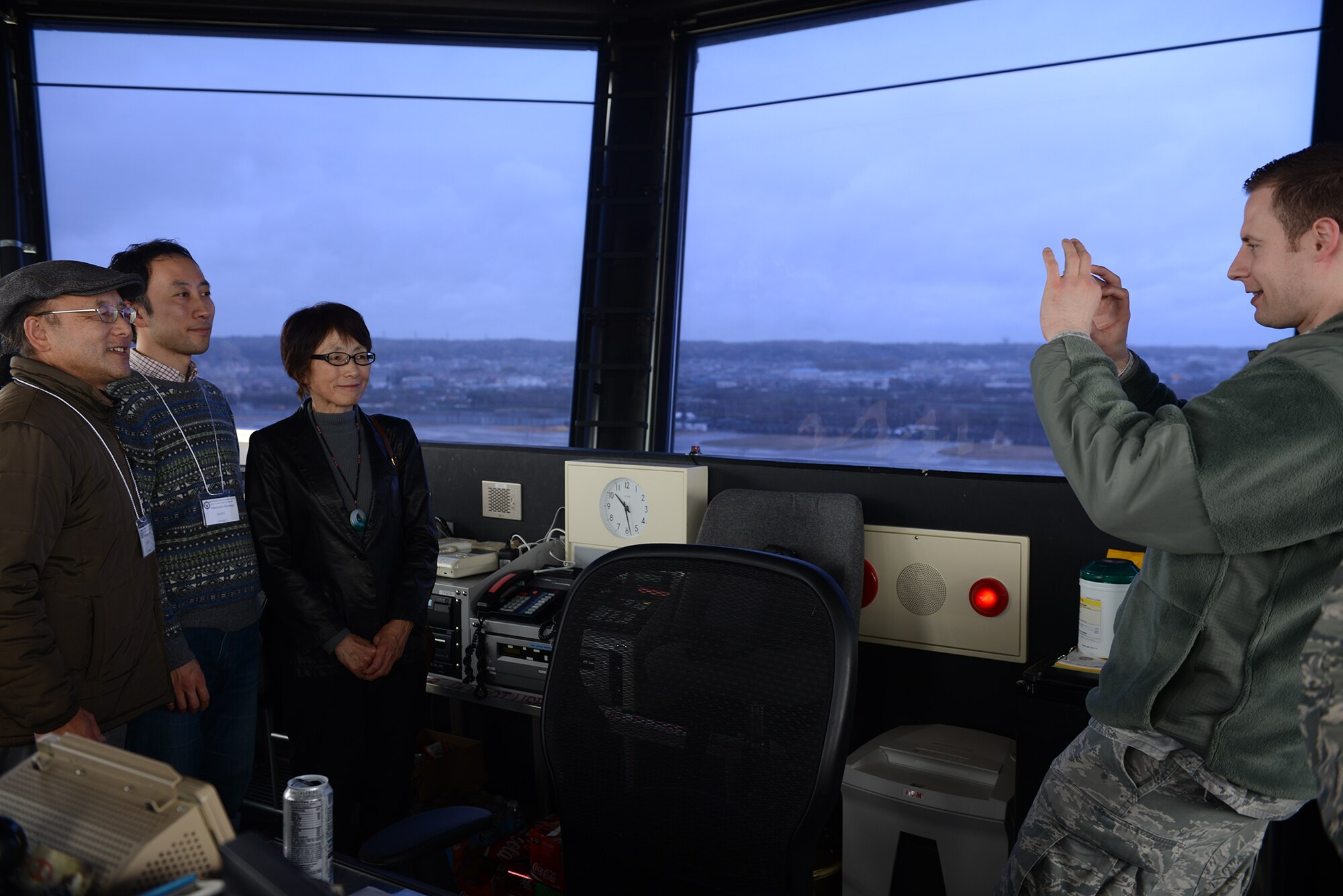 Senior Airman Robert Grady, 374th Operation Support Squadron air traffic controller, takes a photo for members of the Aircraft Owners and Pilots Association-Japan during a tour at Yokota Air Base, Japan, April 11, 2015. Members of AOPA-J took part in a tour as part of the Mid-Air Collision Avoidance conference. (U.S. Air Force photo by Airman 1st Class David C. Danford/Released)