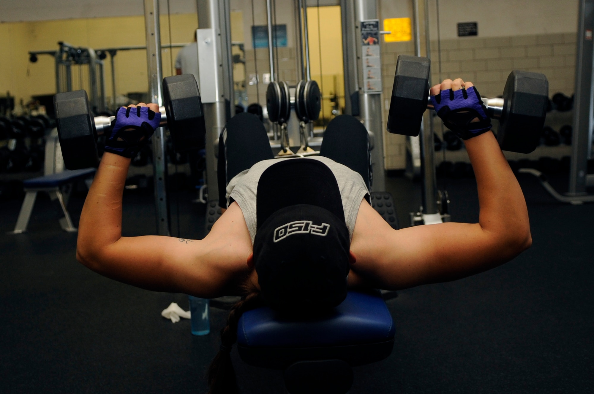 Tech. Sgt. Brittany Spoutz, 30th Force Support Squadron family readiness NCO, works-out at the base gym, April 10, 2015, Vandenberg Air Force Base, Calif. Spoutz is the Vandenberg fitness leader of the month due to her exceptional dedication to physical fitness. (U.S. Air Force photo by Senior Airman Shane Phipps/Released)