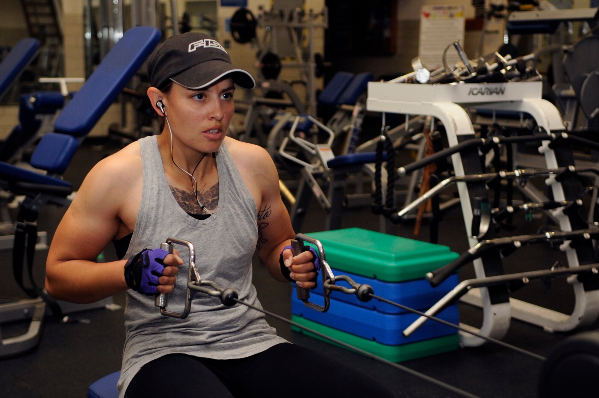 Tech. Sgt. Brittany Spoutz, 30th Force Support Squadron family readiness NCO, works-out at the base gym, April 10, 2015, Vandenberg Air Force Base, Calif. Spoutz is the Vandenberg fitness leader of the month due to her exceptional dedication to physical fitness. (U.S. Air Force photo by Senior Airman Shane Phipps/Released)