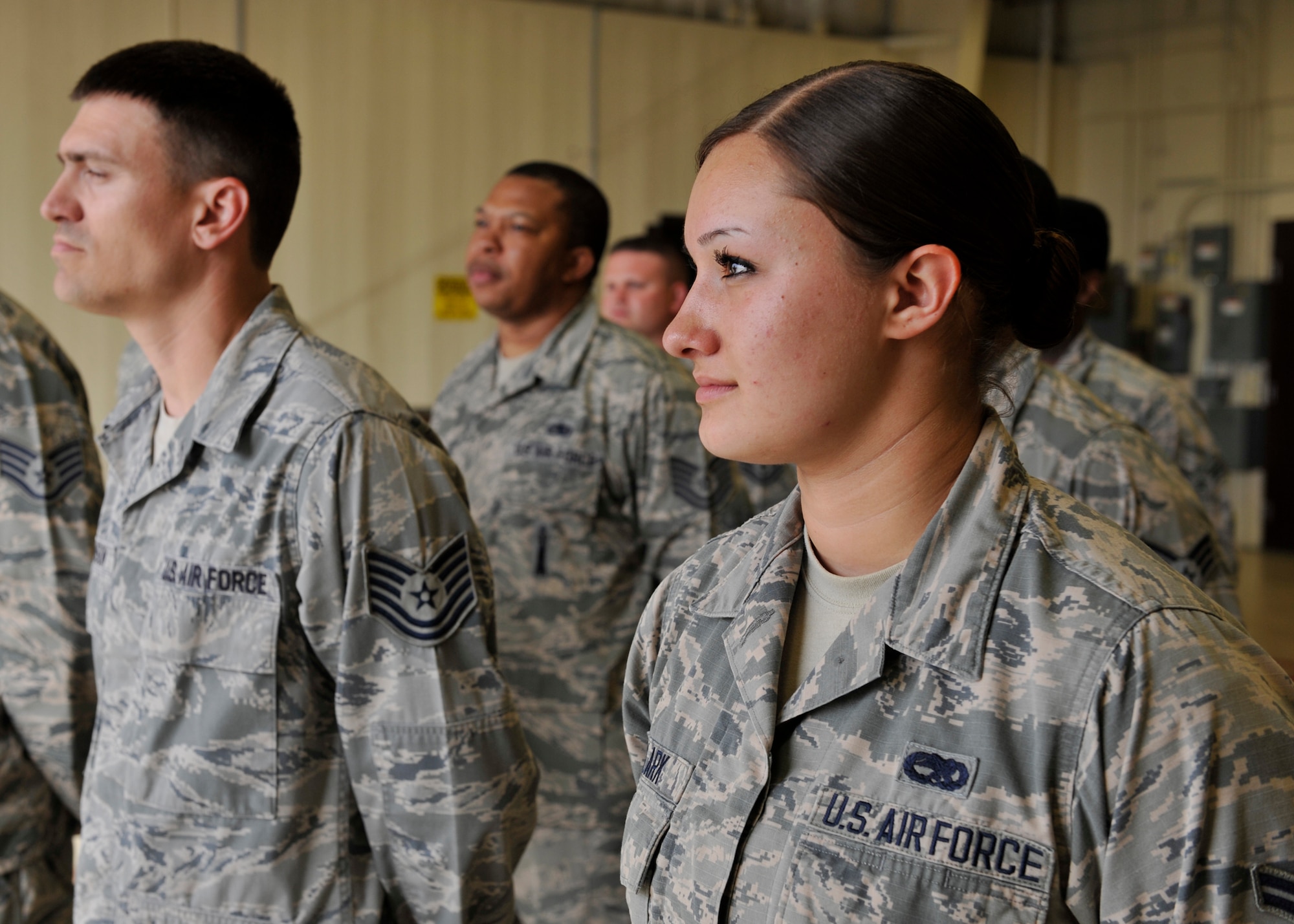 Airman 1st Class Sierra Clark, 325th Maintenance Squadron armament shop team member, waits in formation April 3 at the 325th MXS armament shop. Clarks was chosen by her leadership to be shadowed by the 325th Fighter Wing commander as part of the Airman Shadow Program. (U.S. Air Force photo by Airman 1st Class Sergio A. Gamboa/Released)