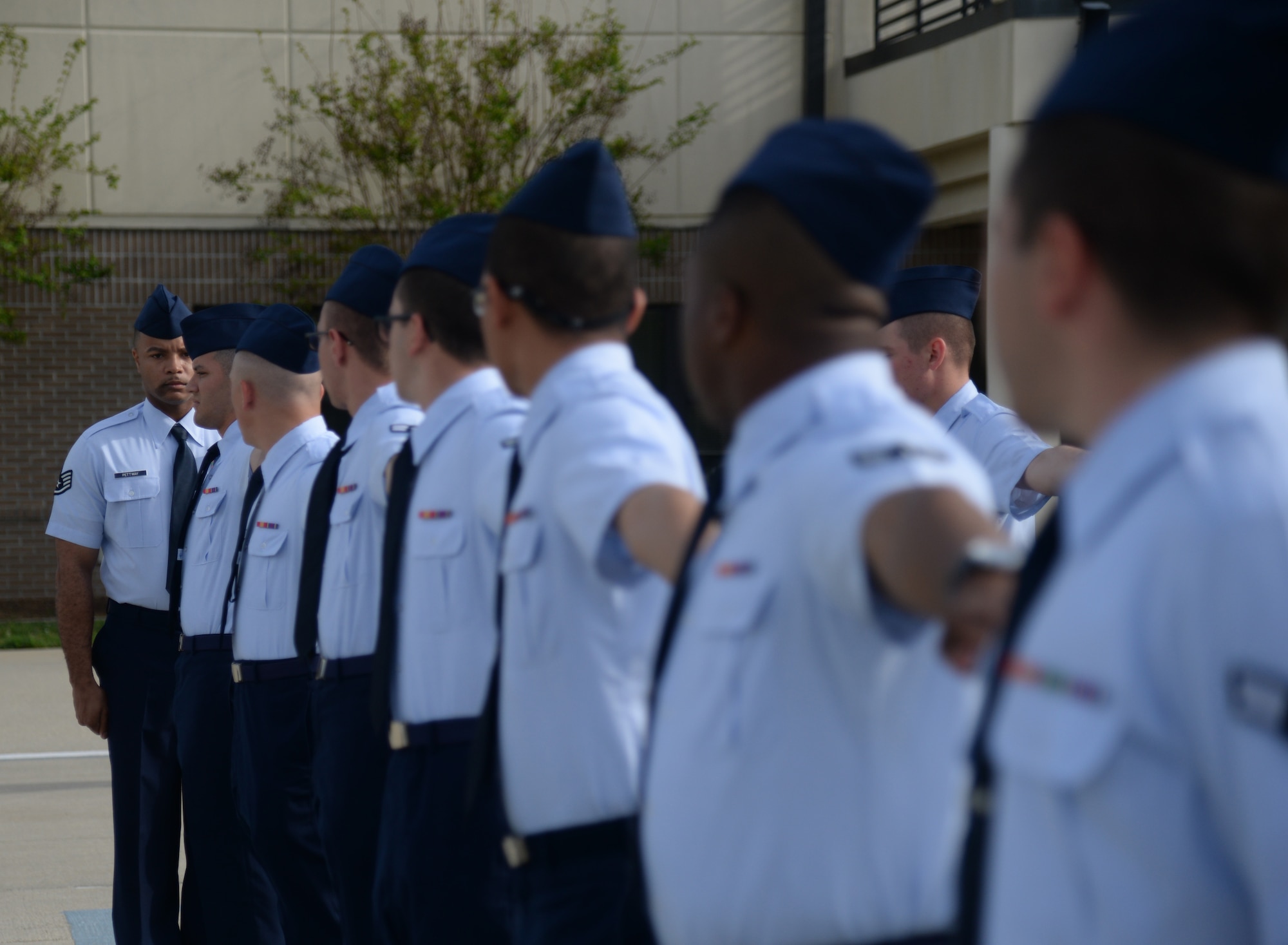 Staff Sgt. Ezekiel Pettway, 334th Training Squadron military training leader, conducts open ranks during the 2015 Top Tech competition April 9, 2015, Keesler Air Force Base, Miss. Four military training leaders participated in the competition by performing drill, open ranks and a 20-minute briefing. (U.S. Air Force photo by Senior Airman Holly Mansfield)