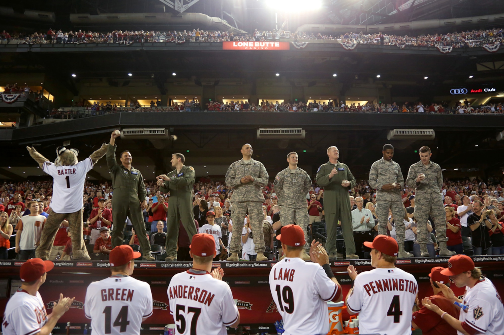 Service members responsible for the F-16 flyover at the Arizona Diamondbacks’ Opening Day are recognized at Chase Field, April 6, 2015. The seven man team helped kick off the Diamondbacks’ 18th season in Major League Baseball.  (Courtesy photo of the Arizona Diamondbacks)