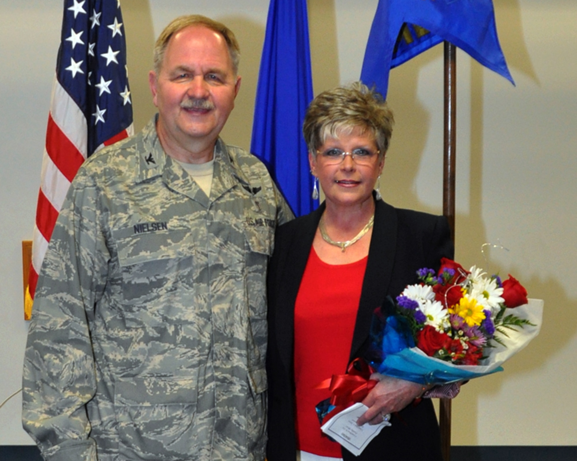 U.S. Air Force Col. Mark Nielsen was accompanied by his wife Laurie as he assumed command of the 307th Medical Squadron at Barksdale Air Force Base, La., April 12, 2015. Col. Nielsen is returning to the 307th Medical Squadron after working at the U.S. Air Force Academy as Individual Mobilization Augmentee to the United States Air Force Academy Command Surgeon and to the Commander of the 10th Medical Group for the past two years.  (U.S. Air Force photo by Master Sgt. Laura Siebert/Released)