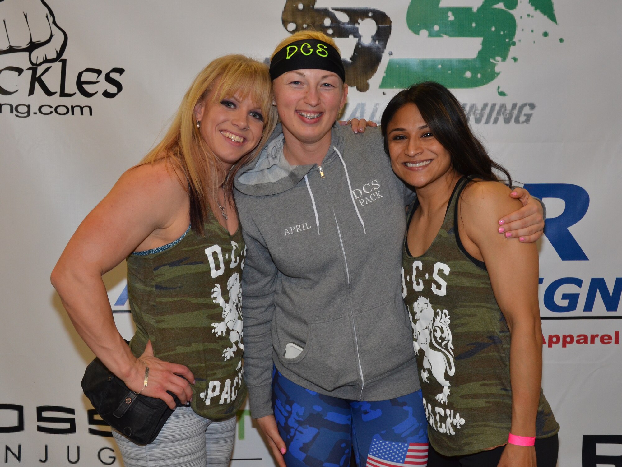 Gracie Vanasse, Decide.Commit.Succeed. Pack head coach and professional powerlifter, left, and DCS Pack powerlifters, U.S. Air Force Staff Sgt. April Spilde and Mayra Armijo, right, pose for a photo at the 2015 Cincinnati Women’s Professional and Amateur Powerlifting Meet in Cincinnati, Ohio, March 12, 2015. Spilde, U.S. Air Force Honor Guard formal training instructor, competed in her first powerlifting competition upon joining the DCS Pack, an online powerlifting community.  (Courtesy photo/ Peter Spilde)
