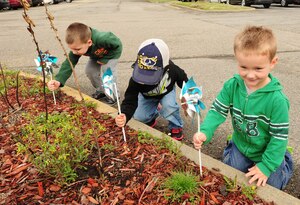 Children from the Langley Air Force Base Child Development Center plant pinwheels as part of Month of the Military Child at Langley Air Force Base, Va., April 10, 2015. Pinwheel planting is a national campaign against child abuse launched by Prevent Child Abuse America in 2008.(U.S. Air Force photo by Staff Sgt. Natasha Stannard/Released) 