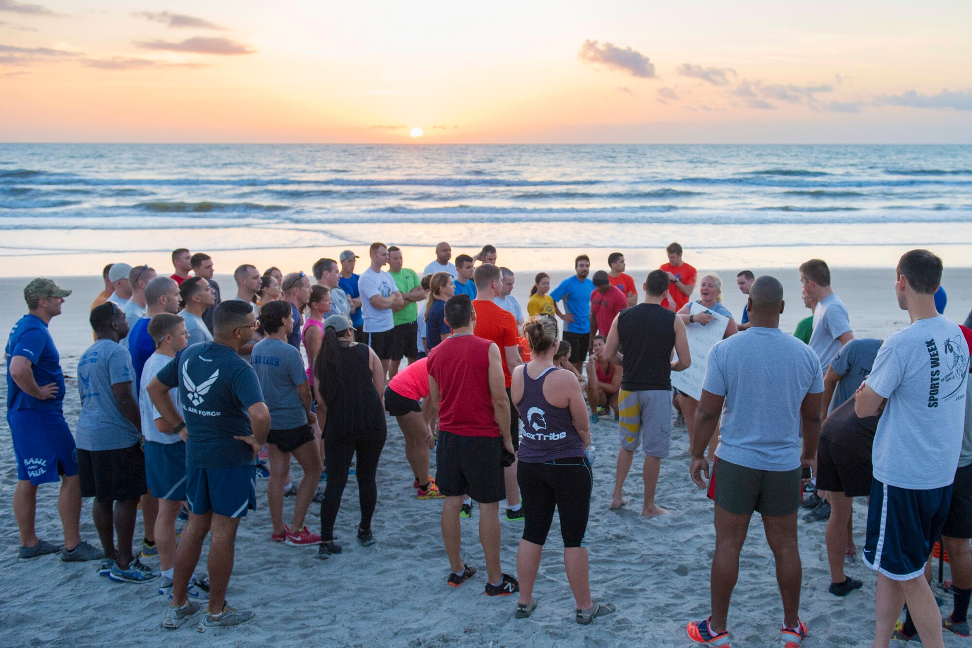 Members of the 45th Space Wing participating in the 2015 Beach Endurance Race gather to listen to Tammy Shelley, fitness and sports manager for the 45th Space Wing, give instructions for the race April 10 behind the Beach House right outside of Patrick Air Force Base, Fla. (U.S. Air Force photo/Matthew Jurgens) (Released)