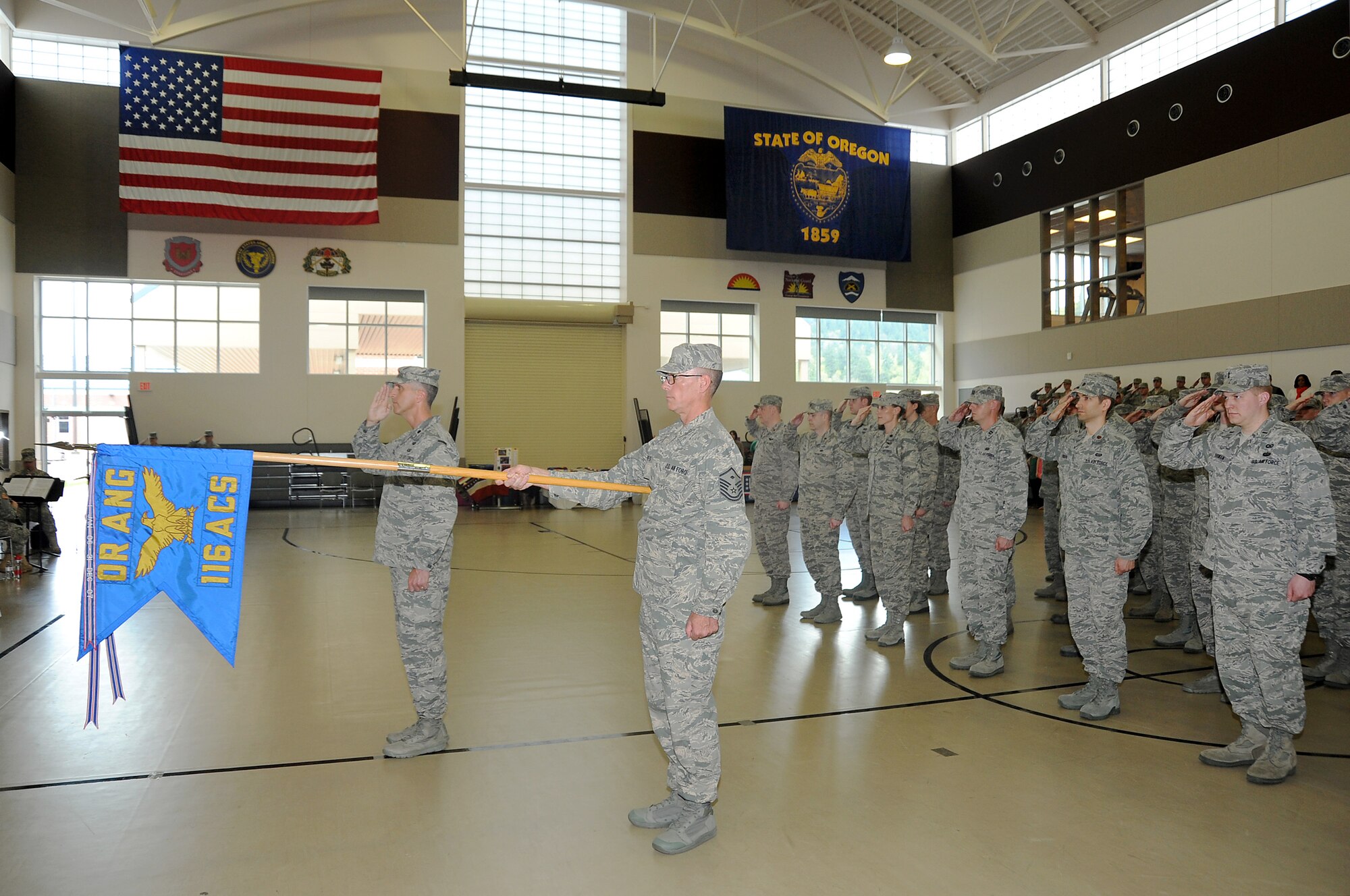 Members of the 116th Air Control Squadron, Oregon Air National Guard, are honored during a mobilization ceremony held at Camp Withycombe, in Clackamas, Ore., April 11, 2015. The 116th ACS, is tasked with a tactical control mission and reporting center, and is part of the Oregon Air National Guard Combat Operations Group. (U.S. Air National Guard Photo by Tech. Sgt. Emily Thompson, 142nd Fighter Wing Public Affairs/Released)