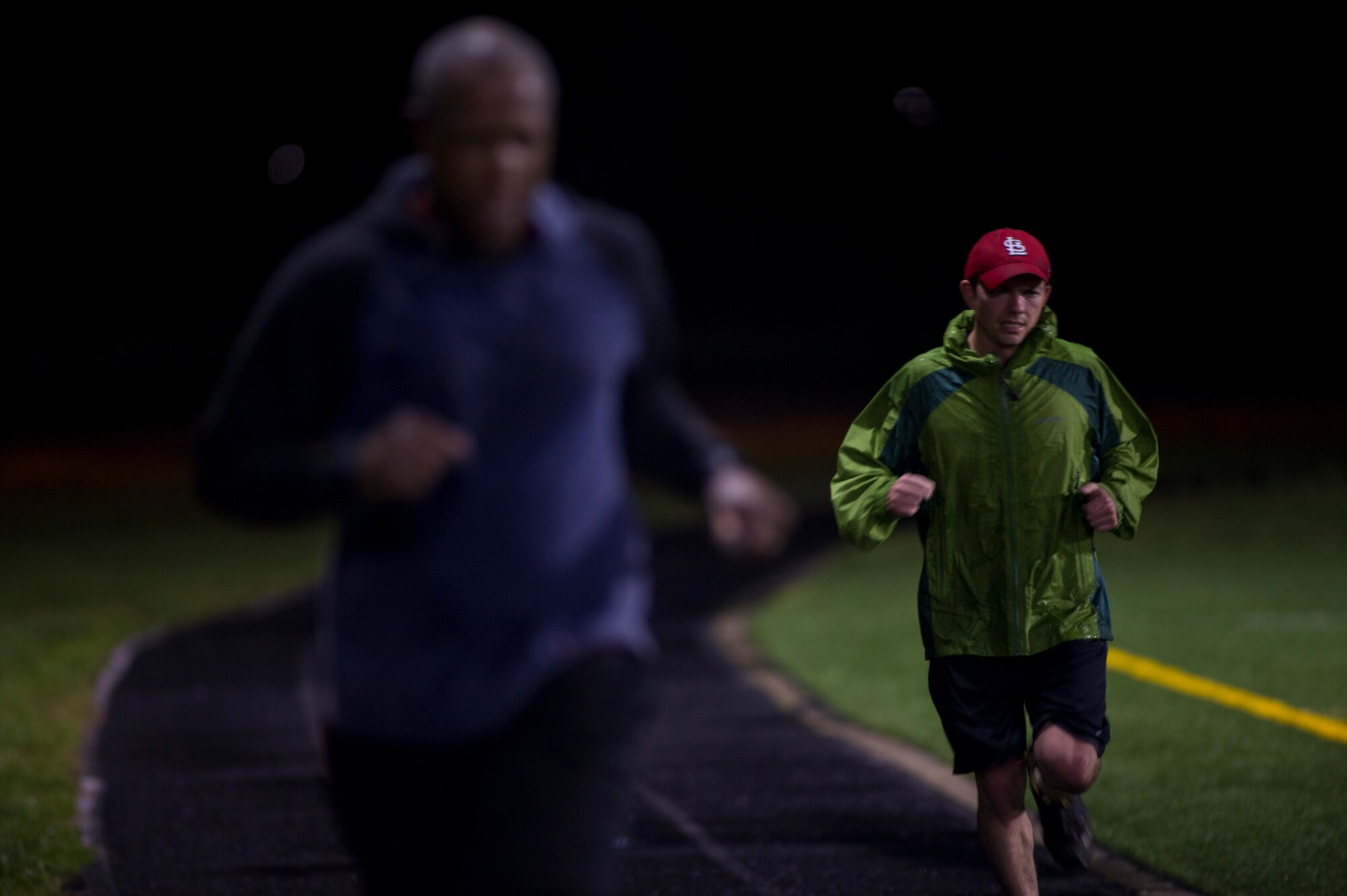 Capt. Steve Bennett, 811th Operations Squadron pilot, participates in a 24-hour Holocaust Remembrance Vigil Run on Joint Base Andrews, April 14, 2015. Approximately 80 people participated in the run, with opening ceremonies officiated by Col. Daniel Waters, 11th Wing vice commander, and closing ceremonies officiated by Col. Bradley Hoagland, 11th Wing commander. (U.S. Air Force photo/Senior Airman Mariah Haddenham)