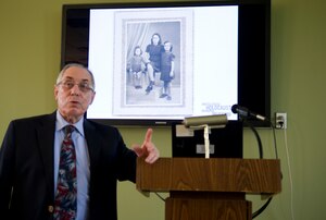 Albert Garih, a holocaust survivor, shares his experience in honor of Holocaust Remembrance Day, at the Chapel 1 Annexon Joint Base Andrews, Md., April 13, 2015. Garih shared his account of the German occupation of Paris and the liberation that followed.  (U.S. Air Force photo/Senior Airman Mariah Haddenham)