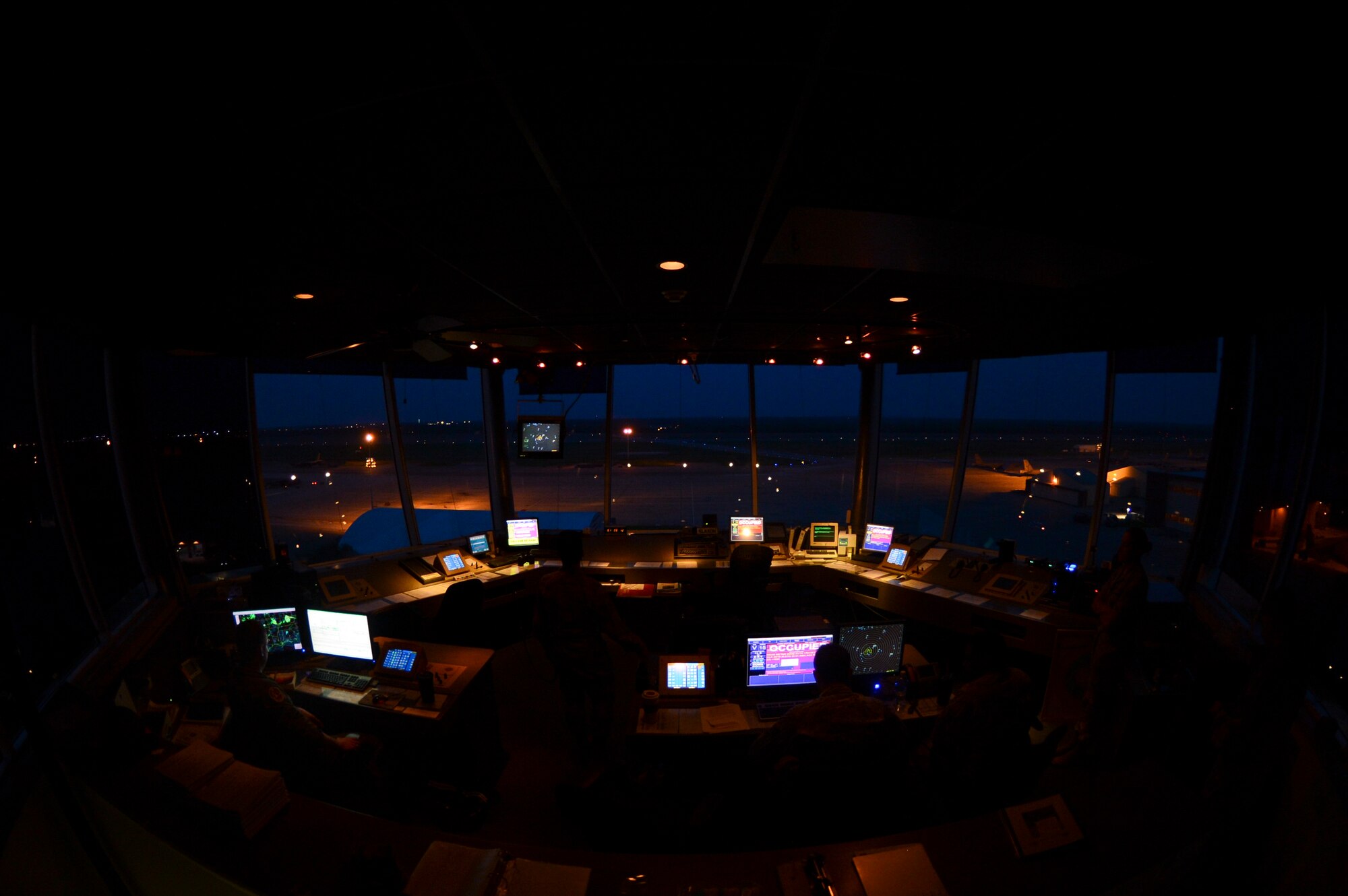 2nd Operations Support Squadron air traffic control Airmen work throughout the night to ensure the safety of aircrew on Barksdale Air Force Base, La., April 8, 2015. Each controller has a part of flight operations, from taxiing on the ground to take-off, and maintaining aircraft in the air to landing them safely. (U.S. Air Force photo/Senior Airman Joseph A. Pagán Jr.)
