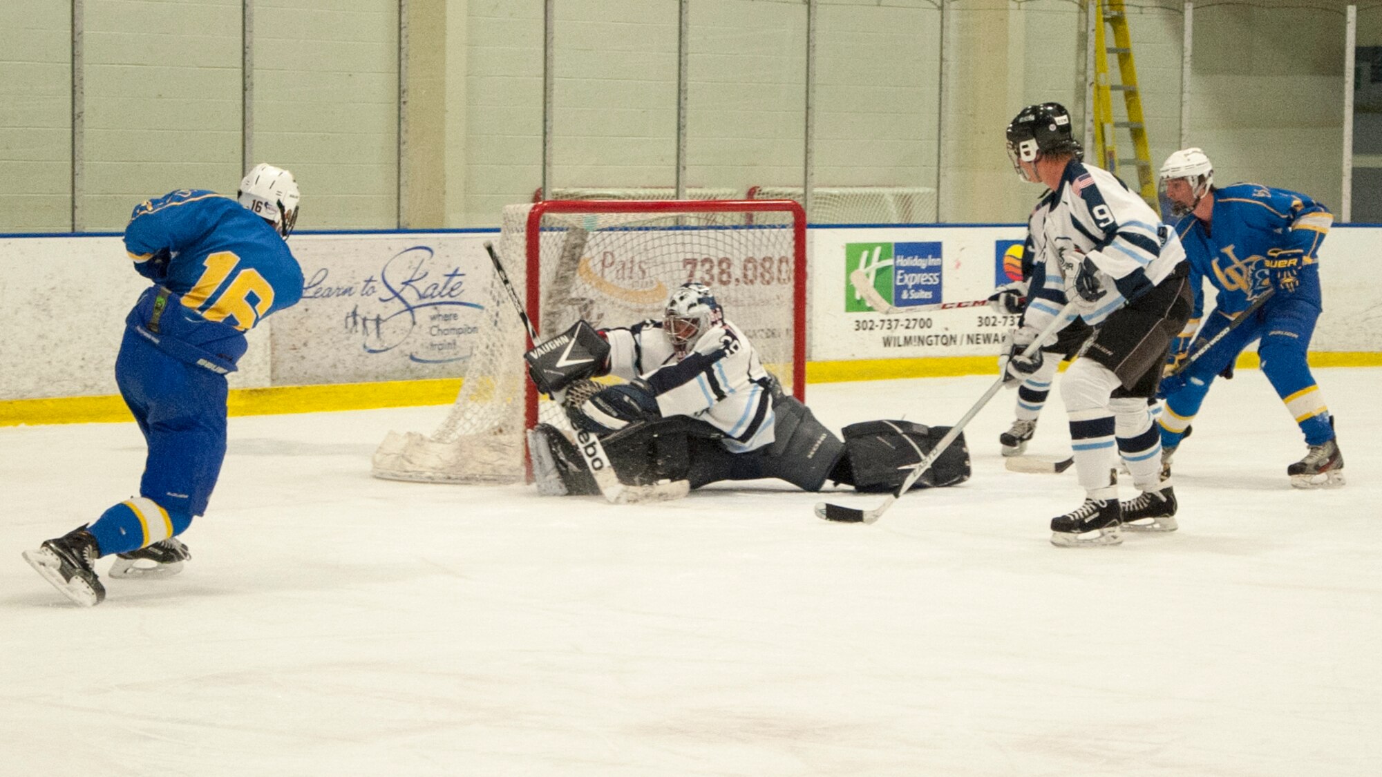 Jeff Kach, Eagles goalie, makes a save April 11, 2015, at the Fred Rust Ice Arena on the University of Delaware campus in Newark, Del. The Eagles ultimately lost to the University of Delaware Blue Hens, American Collegiate Hockey Association men’s division 3, hockey team, 4-1. (U.S. Air Force photo/Senior Airman Jared Duhon) 