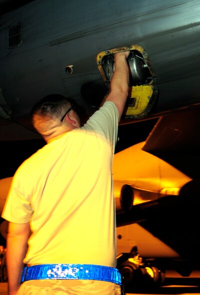 Staff Sgt. Richardt Figueroa, 20th Aircraft Maintenance Unit crew chief, removes a starter cartridge on a B-52H Stratofortress on Barksdale Air Force Base, La., April 8, 2015. A starter cartridge uses shotgun type cartridges filled with gun powder to rapidly start all eight engines on a B-52. This allows the aircraft to take off at a moment's notice if called upon to do so. (U.S. Air Force photo/Staff Sgt. Jason McCasland)