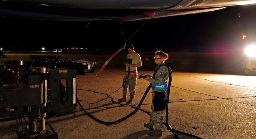 Staff Sgt. Marcella Phillips and Senior Airman David Hansen, 2nd Aircraft Maintenance Squadron weapons loaders, position a common strategic rotary launcher at Barksdale Air Force Base, La., April 8, 2015. For the past 60 years, the B-52H Stratofortress has provided long-range bombing capability and is capable of launching the widest array of weapons in the U.S. arsenal. (U.S. Air Force photo/Staff Sgt. Jason McCasland)