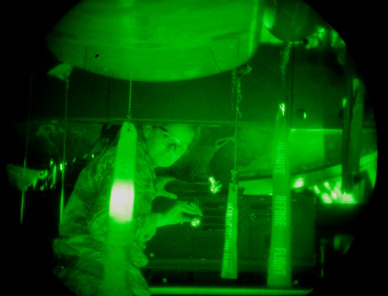 Staff Sgt. Marcella Phillips, 2nd Aircraft Maintenance Squadron weapons loader, checks clearance of a common strategic rotary launcher at Barksdale Air Force Base, La., April 8, 2015. A five person crew is needed to check all clearances of a rotary launcher when loading or unloading inside a B-52H Stratofortress. (U.S. Air Force photo/Staff Sgt. Jason McCasland)