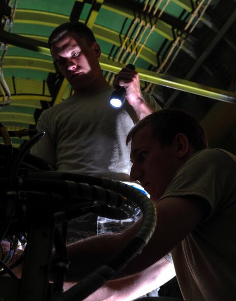 Senior Airmen Cody Brann and Sam Ritzman, 2nd Maintenance Squadron avionics backshop, inspect an electronic counter measure box inside a B-52H Stratofortress on Barksdale Air Force Base, La., April 8, 2015. Avionics is similar to the human body?s nervous system and vital to the flights of the B-52 onboard systems such as flight control, communications and navigation. (U.S. Air Force photo/Staff Sgt. Jason McCasland)
