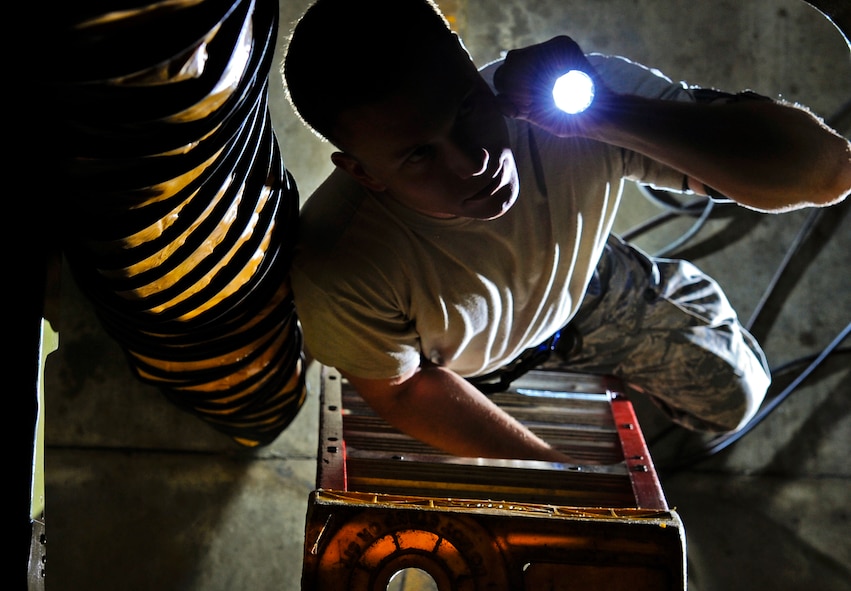 Senior Airman Cody Brann, 2nd Maintenance Squadron avionics backshop, inspects the 47-section of a B-52H Stratofortress on Barksdale Air Force Base, La., April 8, 2015. The B-52 has onboard systems such as flight control, communications and navigation which must be inspected during regular intervals to ensure the systems are working properly. (U.S. Air Force photo/Staff Sgt. Jason McCasland)