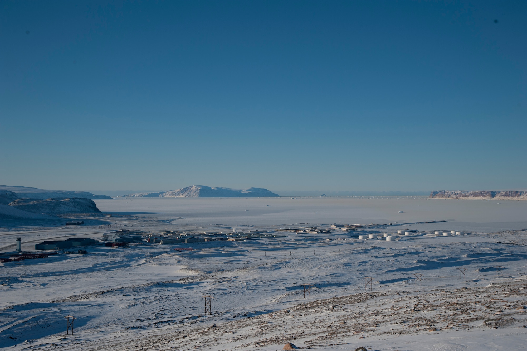 THULE AIR BASE, Greenland – Thule Air Base lies approximately 750 miles north of the Arctic Circle and 946 miles from the North Pole, with temperatures typically ranging from 30 to 40 degrees below zero in the winter to 30 to 40 degrees in the summer. With a population of U.S., Canadian, Danish and Greenlandic personnel, the base provides security, communications, civil engineering, personnel, services, logistics and medical services, supporting the missile warning and space surveillance and satellite command and control operations missions. Operated by the 821st Air Base Group, Thule AB is one of the six installations maintained by the 21st Space Wing. (U.S. Air Force photo by Senior Airman Tiffany DeNault)
