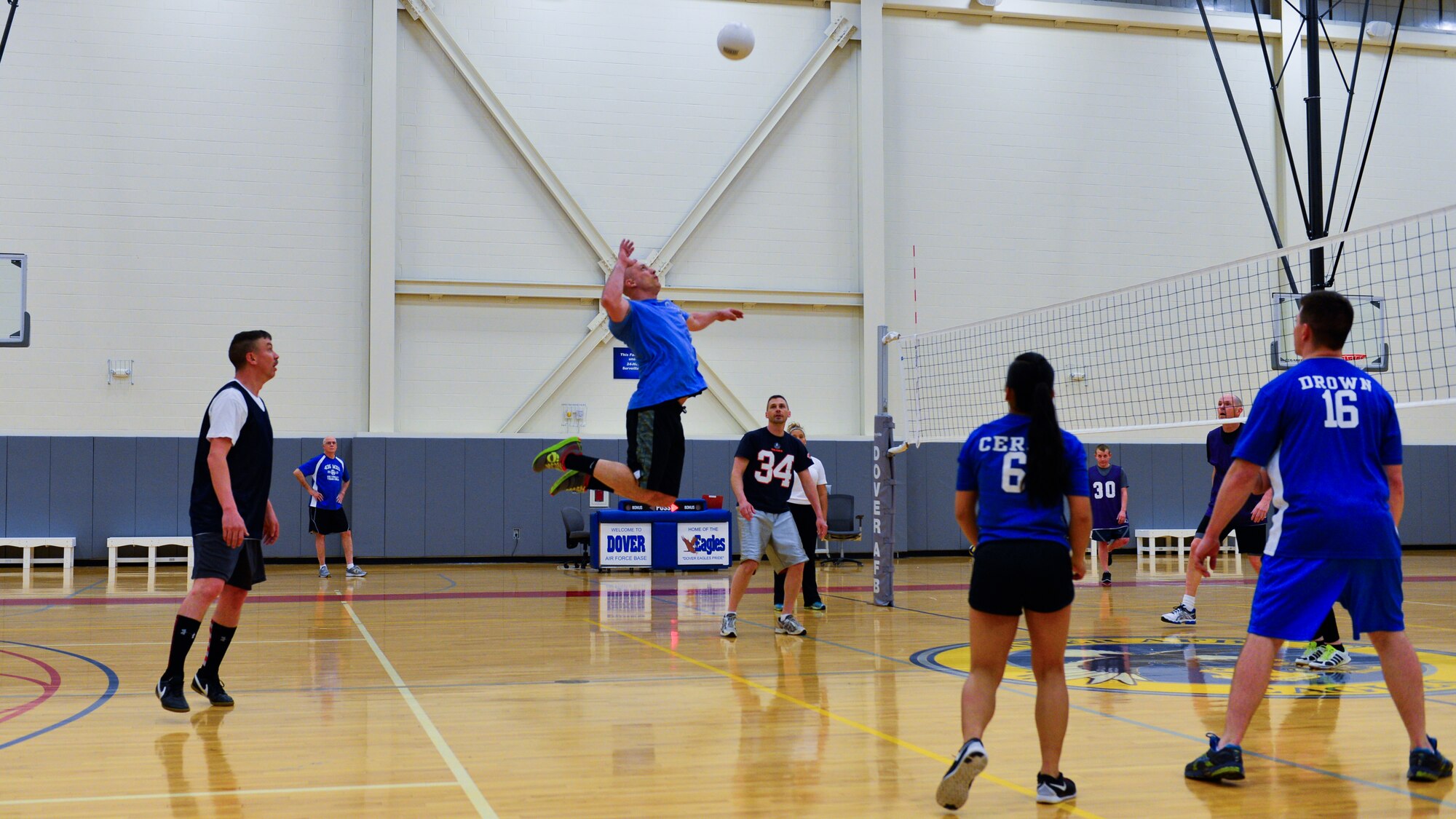 Patrick Piazza, 436th Maintenance Squadron “A” player, jumps to spike a volleyball during an intramural volleyball game April 9, 2015, at the fitness center on Dover Air Force Base, Del. The 436th MXS defeated the 3d AS/436th OSS 25-21, 22-25, 15-9. (U.S. Air Force photo/Airman 1st Class Zachary Cacicia)