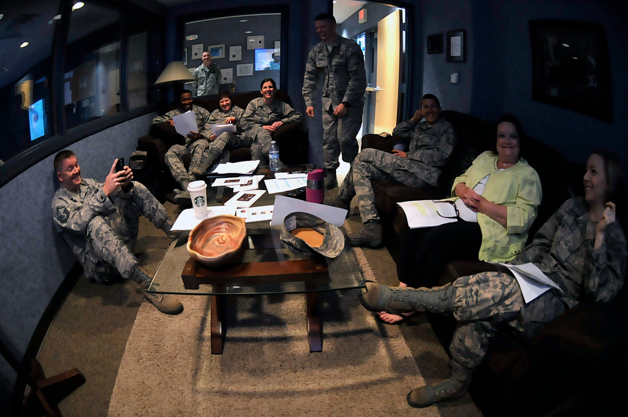 MCGHEE TYSON AIR NATIONAL GUARD BASE, Tenn. - Enlisted professional military education instructors from the Paul H. Lankford EPME Center here laugh in the TEC TV green room April 14, 2015, while watching their peers practice satellite EPME instruction on camera.   (U.S. Air National Guard photo by Master Sgt. Mike R. Smith/Released)