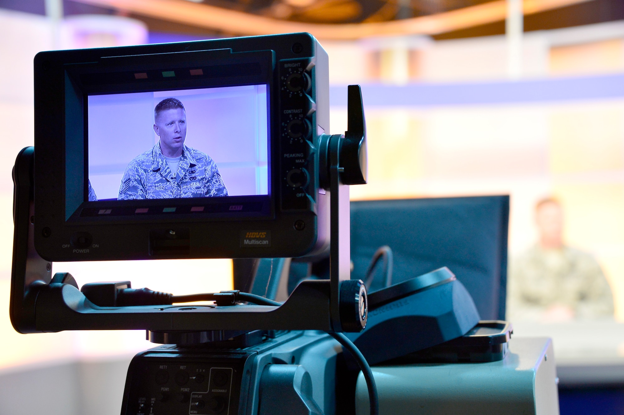 MCGHEE TYSON AIR NATIONAL GUARD BASE, Tenn. - Tech. Sgt. William Bryant, EPME instructor for the Paul H. Lankford EPME Center, reads the teleprompter from the television studio one broadcast desk here at the I.G. Brown Training and Education Center, April 14, 2015, during the on-camera instructors' course.  (U.S. Air National Guard photo by Master Sgt. Mike R. Smith/Released)