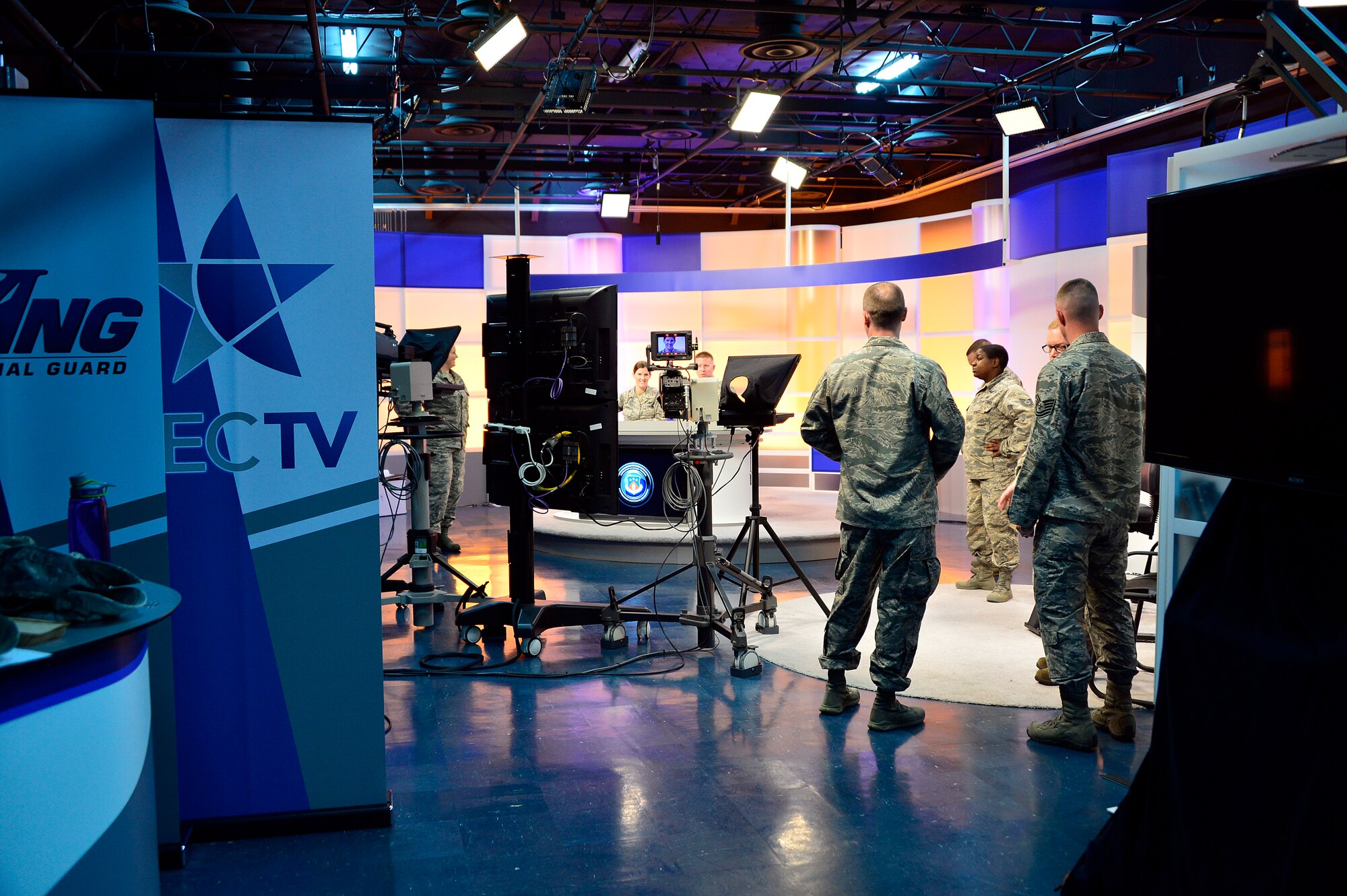 MCGHEE TYSON AIR NATIONAL GUARD BASE, Tenn. - Students, instructors and broadcast technicians prepare to practice on-camera broadcasts here at the I.G. Brown Training and Education Center TEC TV studio one during the on camera instructors' course. The course prepares instructors to teach professional military education through broadcast television.  (U.S. Air National Guard photo by Master Sgt. Mike R. Smith/Released) 