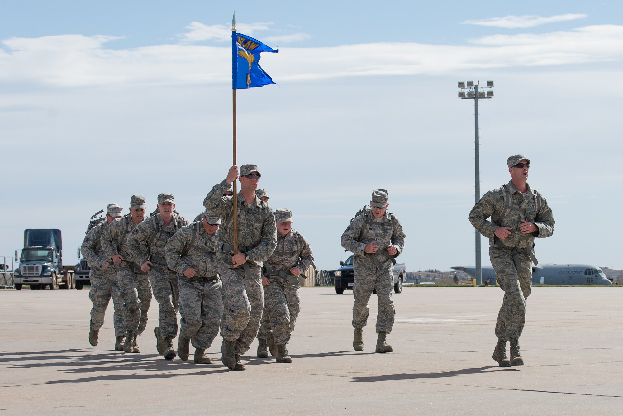 U.S. Air Force Airmen assigned to the 153rd Civil Engineering Squadron, Wyoming Air National Guard, march five kilometers with a 35 pound pack April 12, 2015, at Cheyenne Air National Guard Base in Cheyenne, Wyoming. The Airmen participated in the inaugural Sexual Assault Awareness and Prevention 5k ruck 5k run/walk which raised over $900 for local charities. (U.S. Air National Guard photo by Master Sgt. Charles Delano)