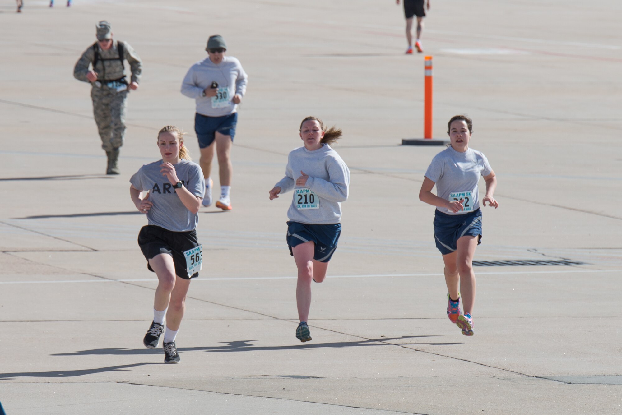 Military Soldiers and Airmen assigned to the Wyoming National Guard along with family members run, walk ,and march five kilometers April 12, 2015, at Cheyenne Air National Guard Base in Cheyenne, Wyo. The Guardsmen and families participated in the inaugural Sexual Assault Awareness and Prevention 5k ruck 5k run/walk which raised over $900 for local charities. (U.S. Air National Guard photo by Master Sgt. Charles Delano)