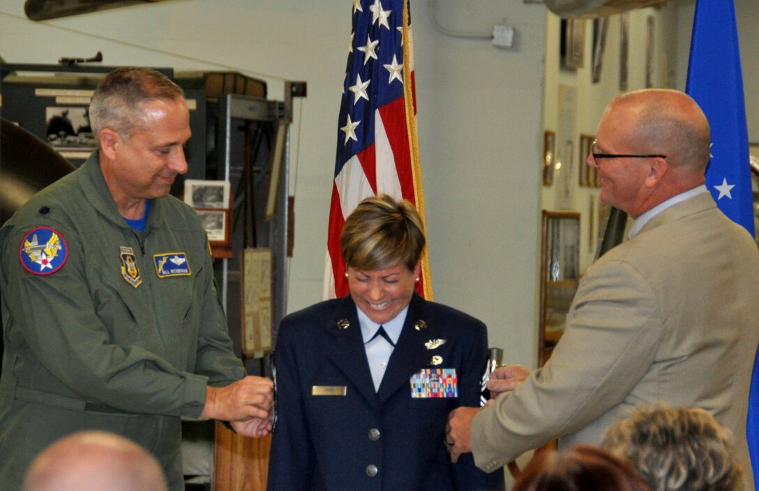TRAVIS AIR FORCE BASE, Calif. -- In a ceremony Apr.10, 2015, at Travis Air Force Base, California, Loadmaster Superintendent Jennifer LePore-Pope pinned on her chief master sergeant chevrons, surrounded by her family, friends and fellow Airmen. (U.S. Air Force photos/Ellen Hatfield)
