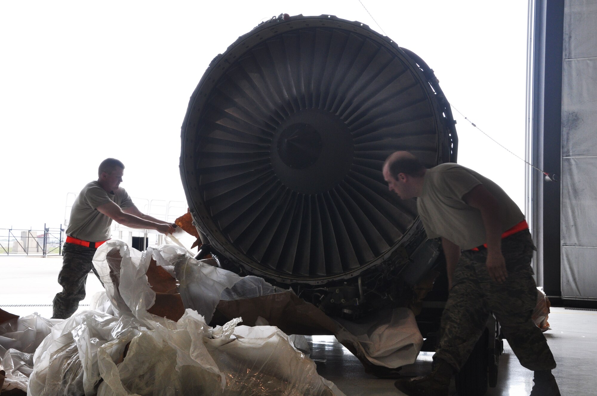 Members of the 931st Maintenance Squadron unwrap a KC-135 Stratotanker F108 engine during a unit training assembly at McConnell Air Force Base, Kan., April 11, 2015. With more than 60 Stratotankers assigned, McConnell operates and maintains the Air Force's largest air refueling fleet, conducting worldwide military operations. (U.S. Air Force photo by Tech. Sgt. Abigail Klein)
