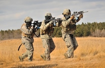 Members of the 791st Missile Security Forces Squadron convoy response force approach a breached vehicle during a tactical training exercise in Garrison, N.D., March 26, 2015. The training prepared the defenders for the Air Force Global Strike Command Road Warrior Exercise, which evaluates the CRF’s capability to respond in combat situations. (U.S. Air Force photo/Airman 1st Class Apryl Hall)