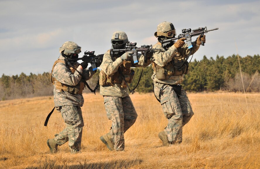 Members of the 791st Missile Security Forces Squadron convoy response force approach a breached vehicle during a tactical training exercise in Garrison, N.D., March 26, 2015. The training prepared the defenders for the Air Force Global Strike Command Road Warrior Exercise, which evaluates the CRF’s capability to respond in combat situations. (U.S. Air Force photo/Airman 1st Class Apryl Hall)