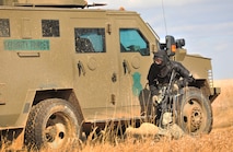 A member of the 791st Missile Security Forces Squadron convoy response force acts as the opposing force during a tactical training exercise in Garrison, N.D., March 26, 2015. Force on force exercises allow defenders to get hands-on combat training in a realistic scenario. (U.S. Air Force photo/Airman 1st Class Apryl Hall)
