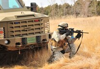 A member of the 791st Missile Security Forces Squadron convoy response force provides security during a tactical training exercise in Garrison, N.D., March 26, 2015. The training prepared the defenders for the Air Force Global Strike Command Road Warrior Exercise, which evaluates the CRF’s capability to respond in combat situations. (U.S. Air Force photo/Airman 1st Class Apryl Hall)