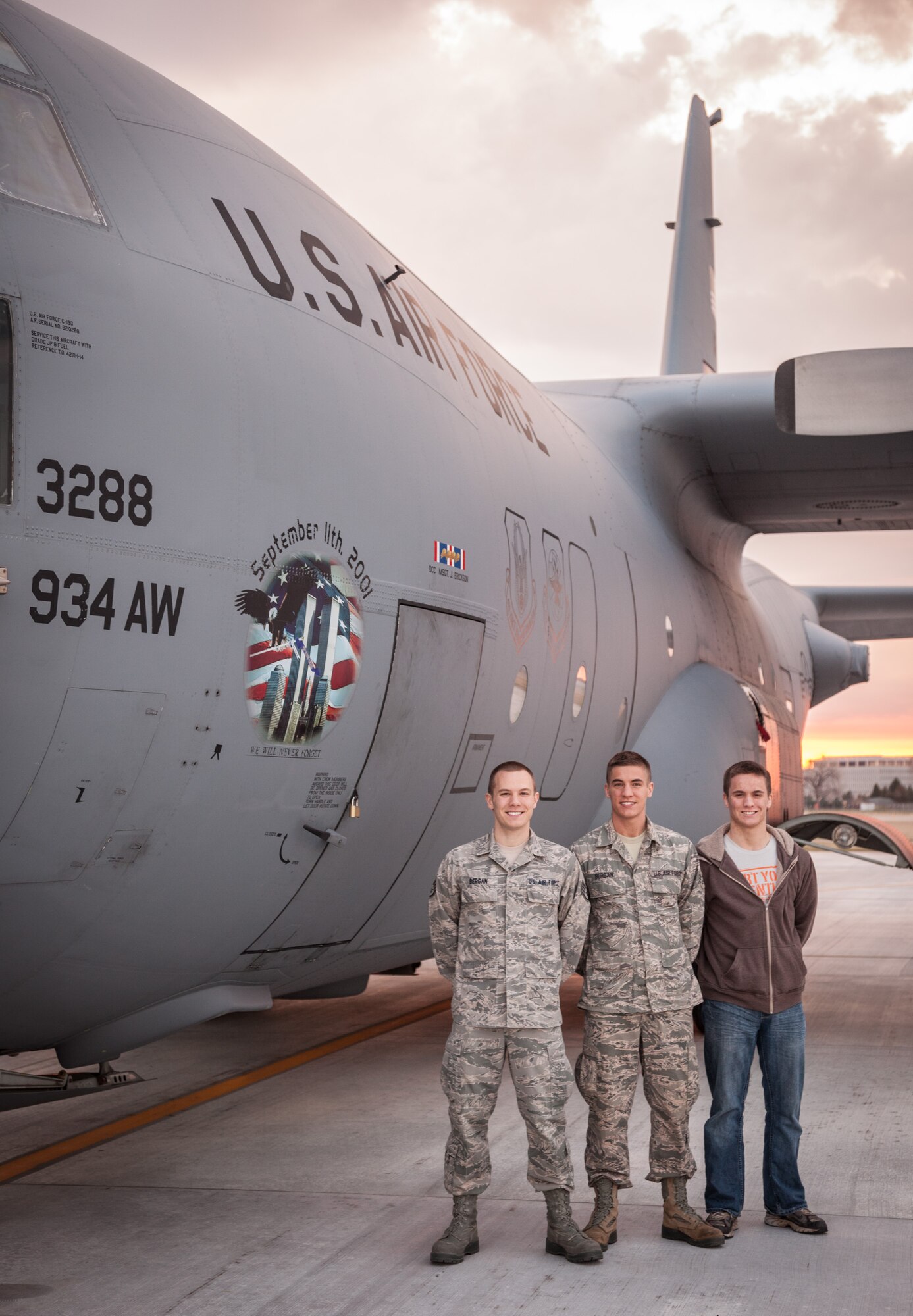 (From left) Brothers Staff Sgt. Nathanial Bergan, 934th Operation Support Squadron, Senior Airman Noah Bergan, 934th Civil Engineering Squadron, and Trainee Andrew Bergan, 934th Development and Training Flight, stand next to a C-130 aircraft during the April unit training assembly weekend.  All three brothers currently serve in the 934th Airlift Wing at the Minneapolis-St. Paul Air Reserve Station, Minn. (U.S. Air Force photo by Shannon McKay/Released)