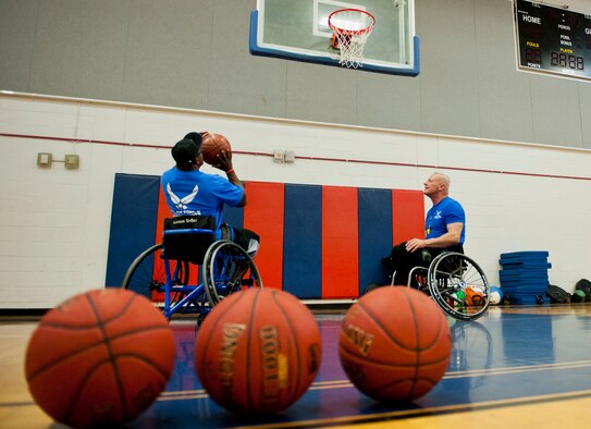 Tremayne Maxwell, an Air Force Wounded Warrior athlete, rolls in for a lay-up during the first day of an introductory adaptive sports and rehabilitation camp at Eglin Air Force Base, Fla., April 13. The DOD’s military adaptive sports program enhances warrior recovery by engaging wounded, ill and injured service members in ongoing, daily adaptive activities, based on their interest and ability.  (U.S. Air Force photo/Samuel King Jr.)