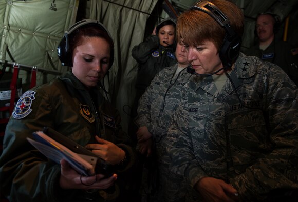 Maj. Gen. Dorothy A. Hogg, director, Medical Operations and Research Office of the Surgeon General, Headquarters U.S. Air Force, listens as she is briefed by Staff Sgt. Alicia Clark, 86th Aeromedical Evacuation Squadron AE technician, March 26, 2015, above Ramstein Air Base, Germany. Hogg observed members of the 86th AES and Tactical Critical Care Evacuation Team — Enhanced during a training flight on board a C-130J Super Hercules. (U.S. Air Force photo/Staff Sgt. Sara Keller)