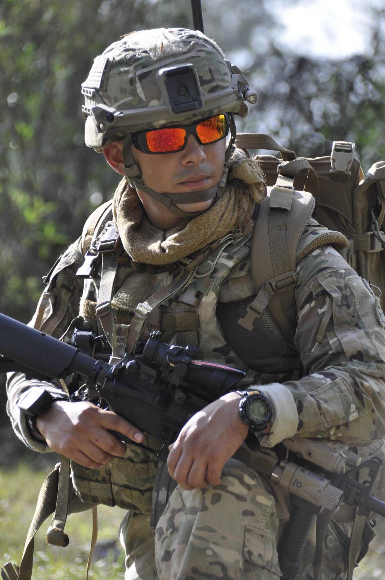 Staff Sgt. Jason Cohen, 482nd Civil Engineering Squadron Explosive Ordnance Disposal team member, takes a knee while he assumes as rear guard duty for his teammate who is working to identify, disarm, and collect evidence left by an Improvised Explosive Device. This was part of a training created to prepare members of the team for deployments by giving Reserve Airmen firsthand experience dealing with IEDs when robotic means aren't feasible. (U.S. Air Force photo by Senior Airman Aja Heiden)