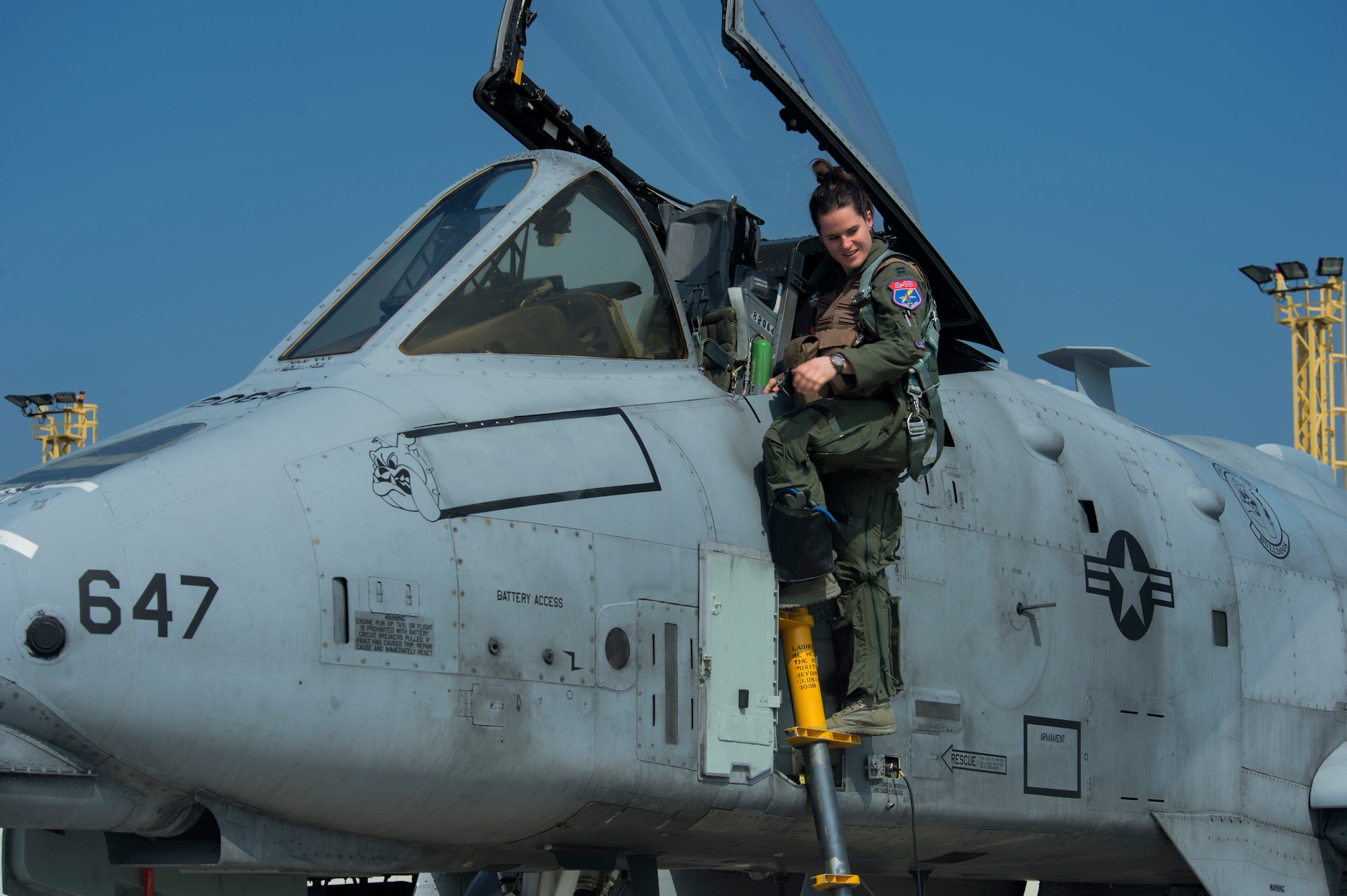 A pilot assigned to the 354th Expeditionary Fighter Squadron climbs out of an A-10 Thunderbolt II attack aircraft after a training mission during a theater security package deployment to Namest Air Base, Czech Republic, April 10, 2015. The pilots are training with the Czech Republic air force's joint terminal attack controllers and conducting close-air support scenarios. (U.S. Air Force photo by Staff Sgt. Christopher Ruano/Released)