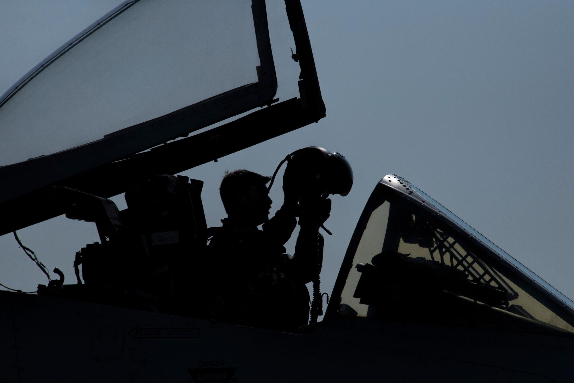 A U.S. Air Force A-10 Thunderbolt II attack aircraft pilot assigned to the 354th Expeditionary Fighter Squadron dons his helmet in preparation for flight during a theater security package deployment to Namest Air Base, Czech Republic, April 10, 2015. The pilots will conduct training alongside NATO allies to strengthen interoperability and demonstrate U.S. commitment to the security and stability of Europe. (U.S. Air Force photo by Staff Sgt. Christopher Ruano/Released)