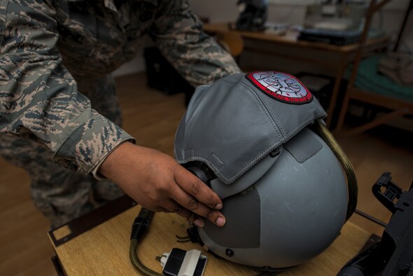 An air crew flight equipment technician assigned to the 354th Expeditionary Fighter Squadron preps a U.S. Air Force pilot’s helmet during an A-10 Thunderbolt II attack aircraft theater security package deployment to Namest Air Base, Czech Republic, April 10, 2015. The helmets are assembled before missions to ensure they are properly cleaned and functioning correctly. (U.S. Air Force photo by Staff Sgt. Christopher Ruano/Released)