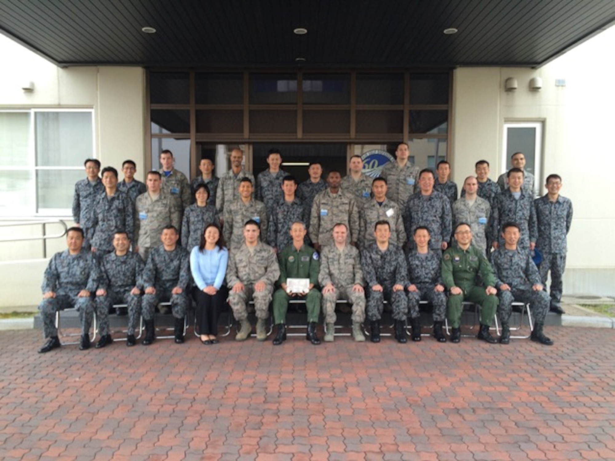 U.S. Air Force and Japan Air Self-Defense Force members pose for a picture outside the wing building during the noncommissioned officer exchange program at Komaki Air Base, Japan, March 27, 2015. Yokota’s Airmen were able to tour the facilities, see day-to-day operations and work with our Japanese counterparts. (Courtesy photo) 