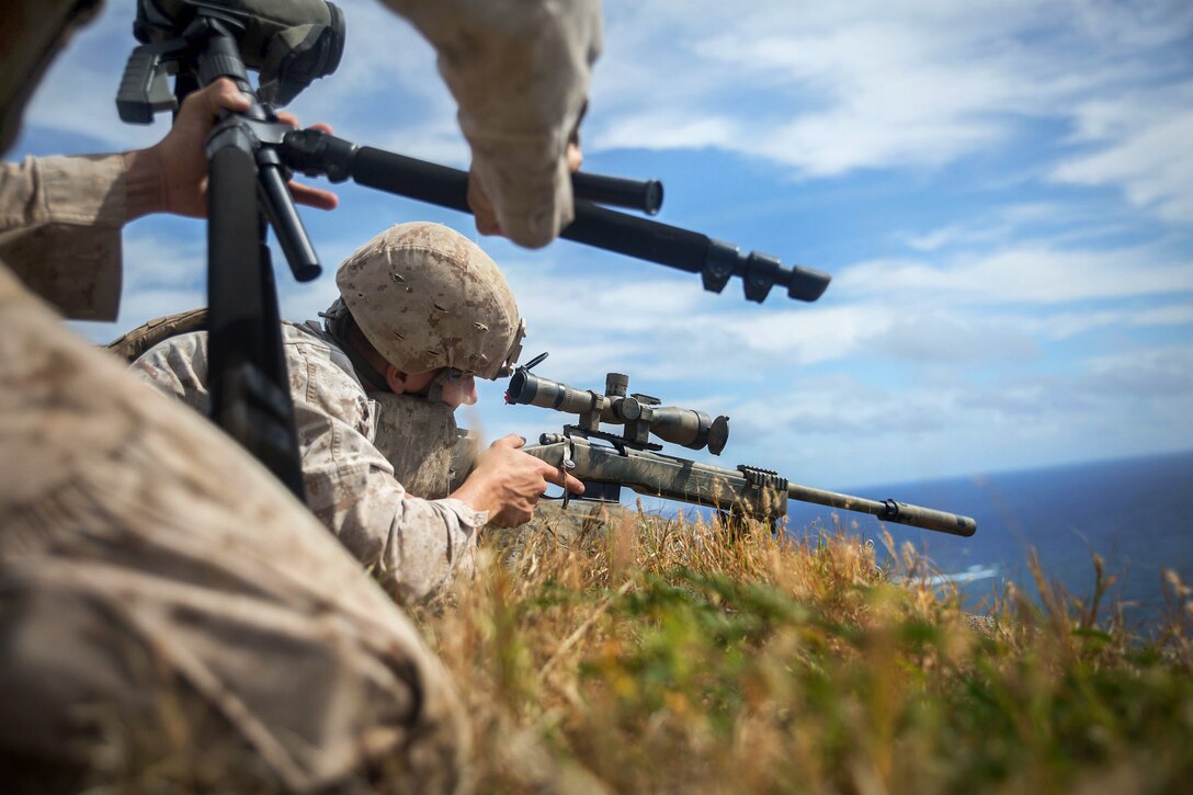 Marines fire M40 and M110 sniper rifles at targets more than 800 meters (about 2,625 feet) downrange at Ulupau Crater on Marine Corps Base Hawaii, April 8, 2015.