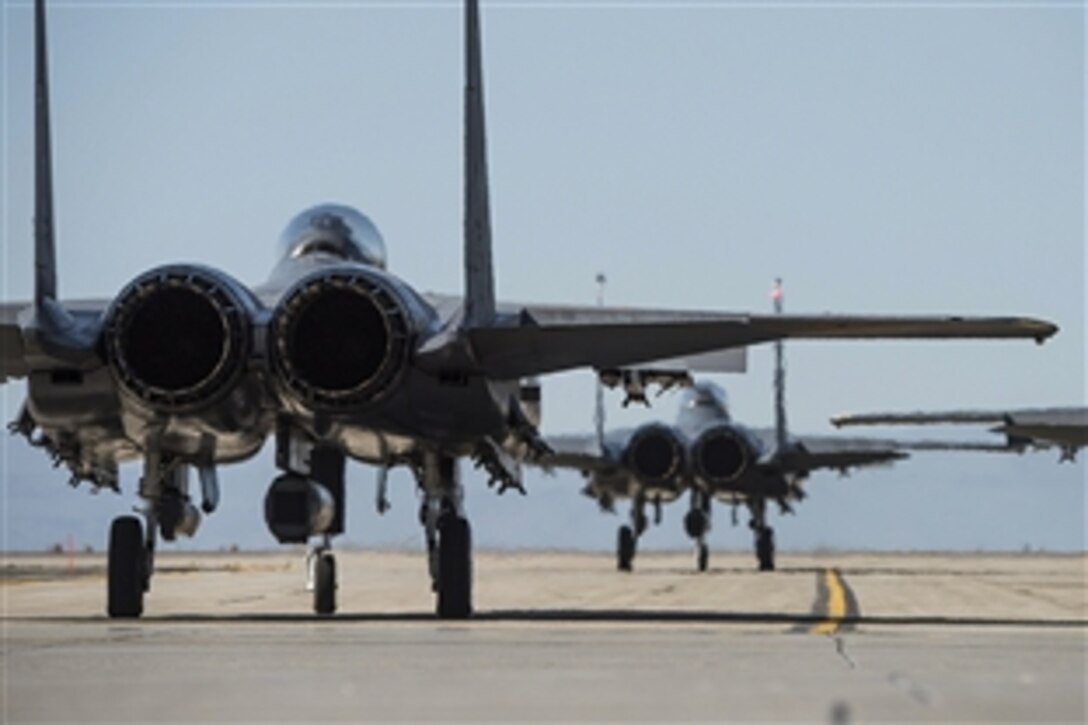 F-15E Strike Eagles await approval to take off from Mountain Home Air Force Base in Idaho during exercise Gunfighter Flag 15-2, April 13, 2015. Military members and civilians across the base participated in the event.